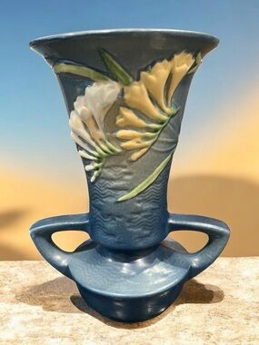 Vintage 1944 Roseville Pottery Freesia pattern Delft Blue vase with handles.